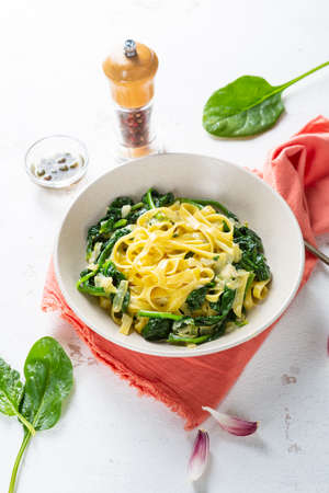 Spinach vegan homemade pasta in white plate, healthy foodの写真素材