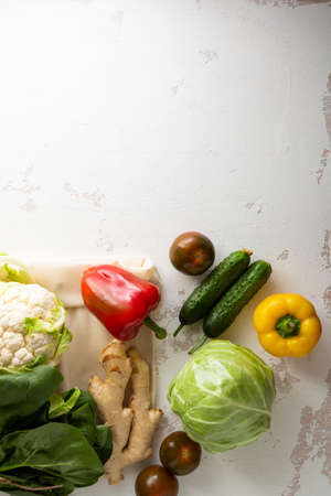 Fresh organic produce top view on white surfaceの写真素材