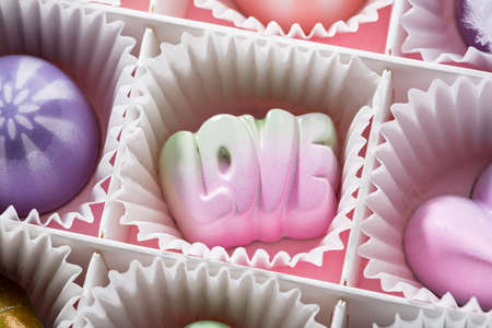 Modern chocolate candy in box close upの写真素材