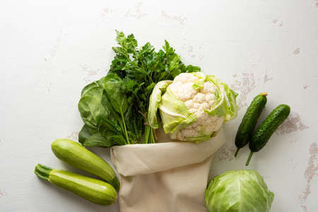 Variety of green vegetables in cotton bag