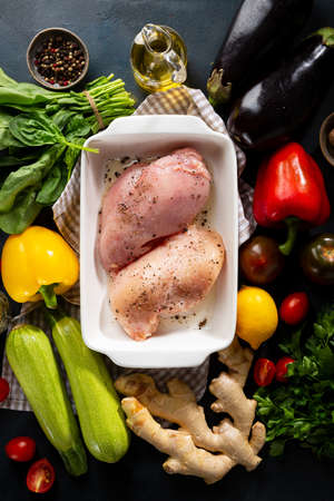 Chicken in baking dish ready for roastingの写真素材