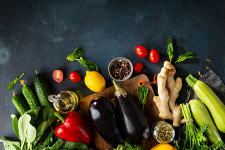 Different fruits and herbs on dark blue background. Vegan ingredientsの写真素材