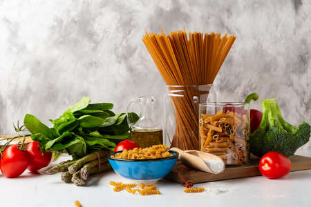 Cooking concept italian whole wheat pasta and vegetablesの写真素材