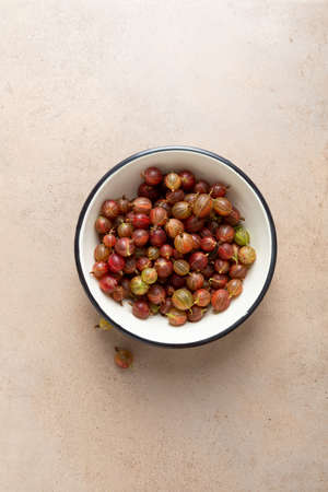 Overhead view of fresh gooseberry in bowlの写真素材