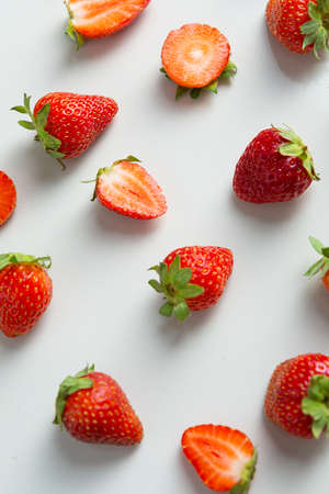 Close up of ripe strawberry on white tableの写真素材