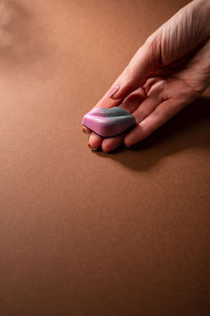 Candy in shape of lips in handsの写真素材