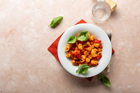 Overhead view of vegan pasta with tomato sauce, healthy food conceptの写真素材