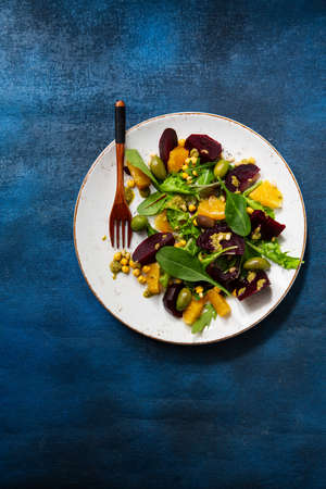 Overhead view of beetroot salad on dark surfaceの写真素材