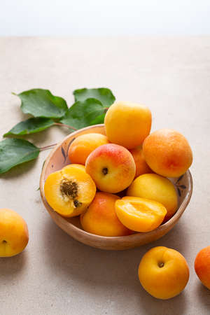 Close up of Raw ripe apricots in bowlの写真素材