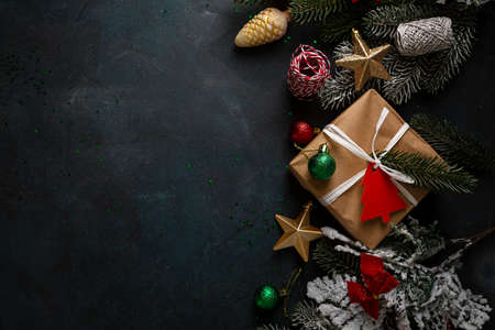 Dark Christmas background with gift box and decorationsの写真素材