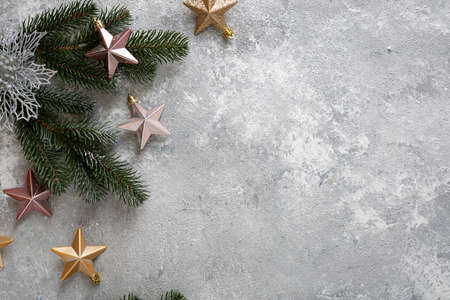 Overhead view of Silver and golden Christmas decorations and green branchesの写真素材