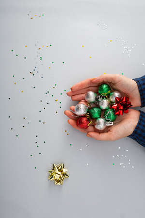 Christmas decorations top view in women hands, holiday conceptの写真素材