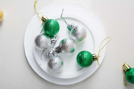 Christmas baubles fron above on stone plate, holiday conceptの写真素材