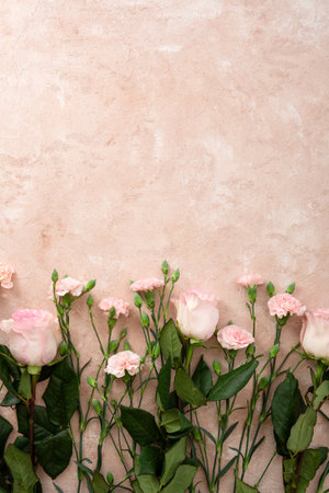Overhead view of Flowers composition made of coral carnation and pink rosesの写真素材