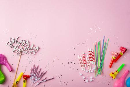 Set of birthday cake candles and small stars on pink backgroundの写真素材