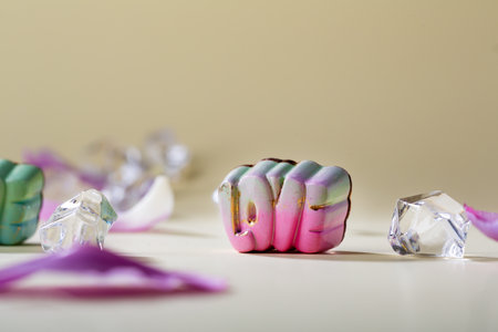 Love letters shape chocolate candies on golden backgroundの写真素材