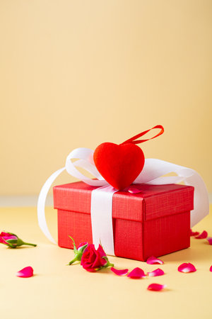 Holiday Valentines Day composition with gift box and red heart decorの写真素材