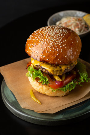 fresh tasty burger on black tableの写真素材
