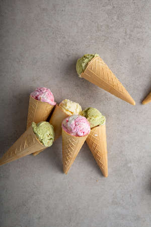 Overhead view of different ice cream in cones, gelato