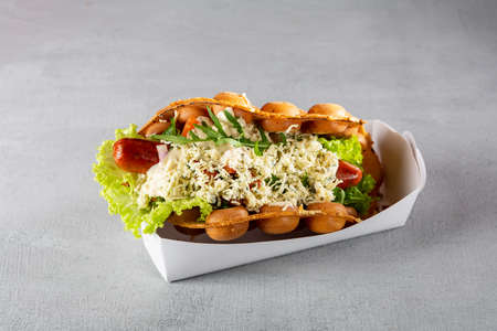 Take away food wafer with salad and sausageの写真素材