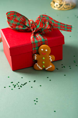 Christmas concept with red gift box and cookieの写真素材