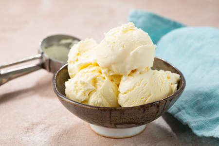 Close up of scoops gelato in bowl on light tableの写真素材