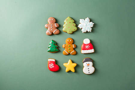 Christmas concept cookies on green surface flat layの写真素材