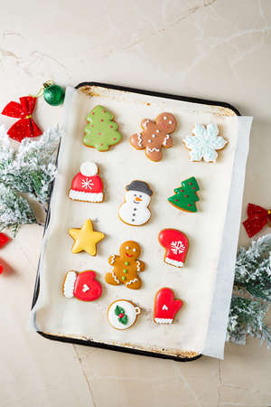 Overhead view of Christmas bisÑuits on baking trayの写真素材