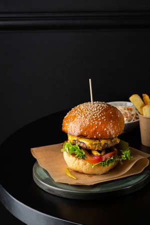 Fast food burger on black table, take awayの写真素材