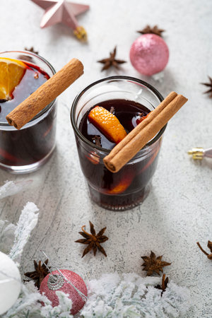 Winter spice wine beverages with orange and Christmas decorationsの写真素材