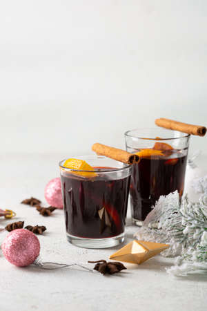 Two glasses of hot wine with spice and fruits winter beveragesの写真素材