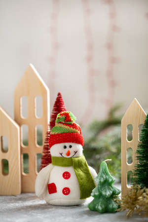 Cute Christmas Snowman and wooden housesの写真素材