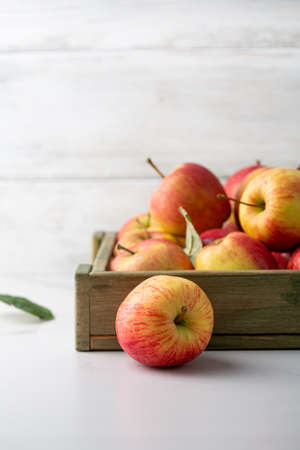 Close up of apple on table and crate autumn conceptの写真素材