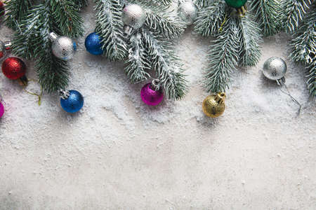 Small Christmas decorations and snow on fir branches copy spaceの写真素材