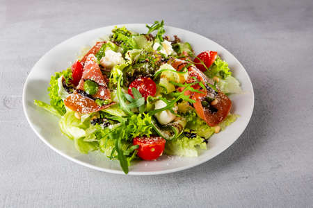 Close up of summer salad with italian proscuitto slices foodの写真素材