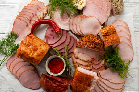 Overhead view of sliced various meat and ham food