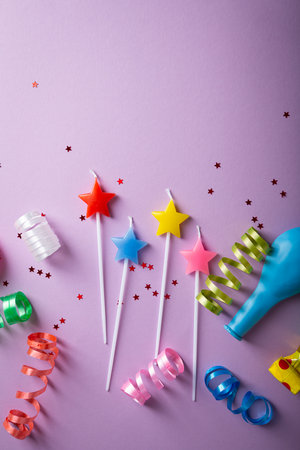 Violet happy birthday background with candles copy spaceの写真素材