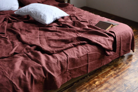 Brown linen bedding and white pillow close upの写真素材