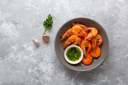 Overhead view of tiger prawn and spices in bowlの写真素材