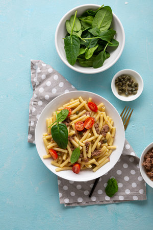Pasta with tuna and tomatoes top view foodの写真素材