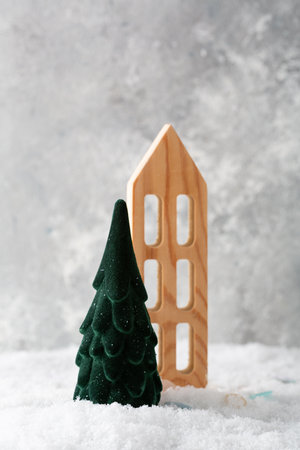 Festive green Christmas tree holiday concept copy space and wooden houseの写真素材