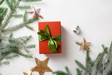 Present box top view and Christmas decorations holiday concept light surface copy spaceの写真素材