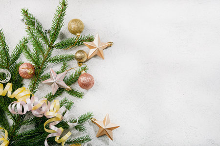 Light Christmas holiday background with green branches decor copy spaceの写真素材