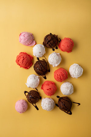 Top view fruit ice cream scoops gelato summer food yellow backgroundの写真素材