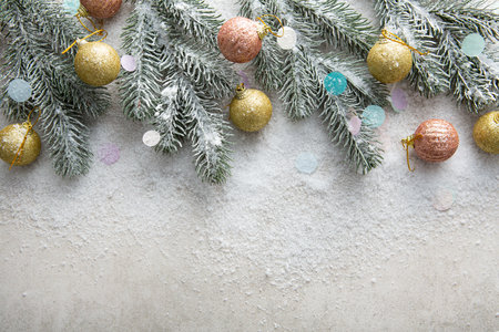 Christmas holiday background with copy space decorations green branch snow top viewの写真素材