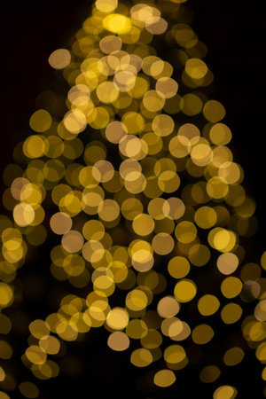 Christmas tree festive bokeh lighting, blurred holiday backgroundの写真素材