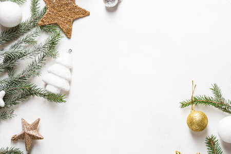 Christmas holiday background with green snowy branches decorations and copy space top viewの写真素材
