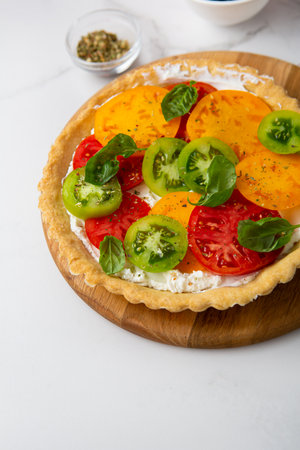 Close up of savory pie with cheese and tomatoes sliceの写真素材