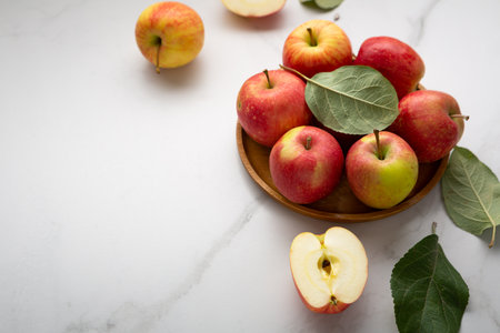 Fresh red and yellow apples on plate healthy foodの写真素材