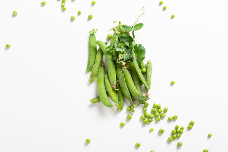 Overhead view of ripe green sweet peas pods and beansの写真素材